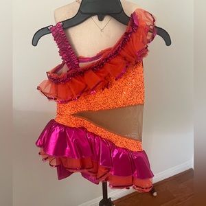 Pink and Orange costume for dance . With wrist accessories and hair piece .
